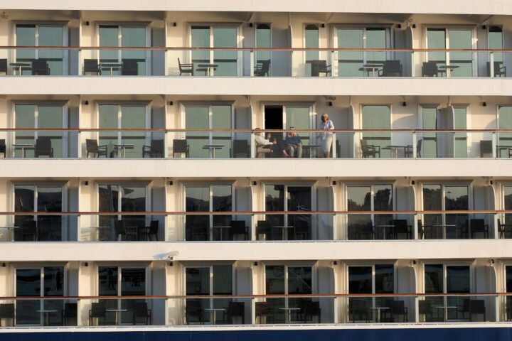 Rows of balcony cabins on the side of a cruise ship